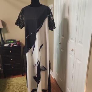 Elegant Black and White Dress with Lace Sleeves